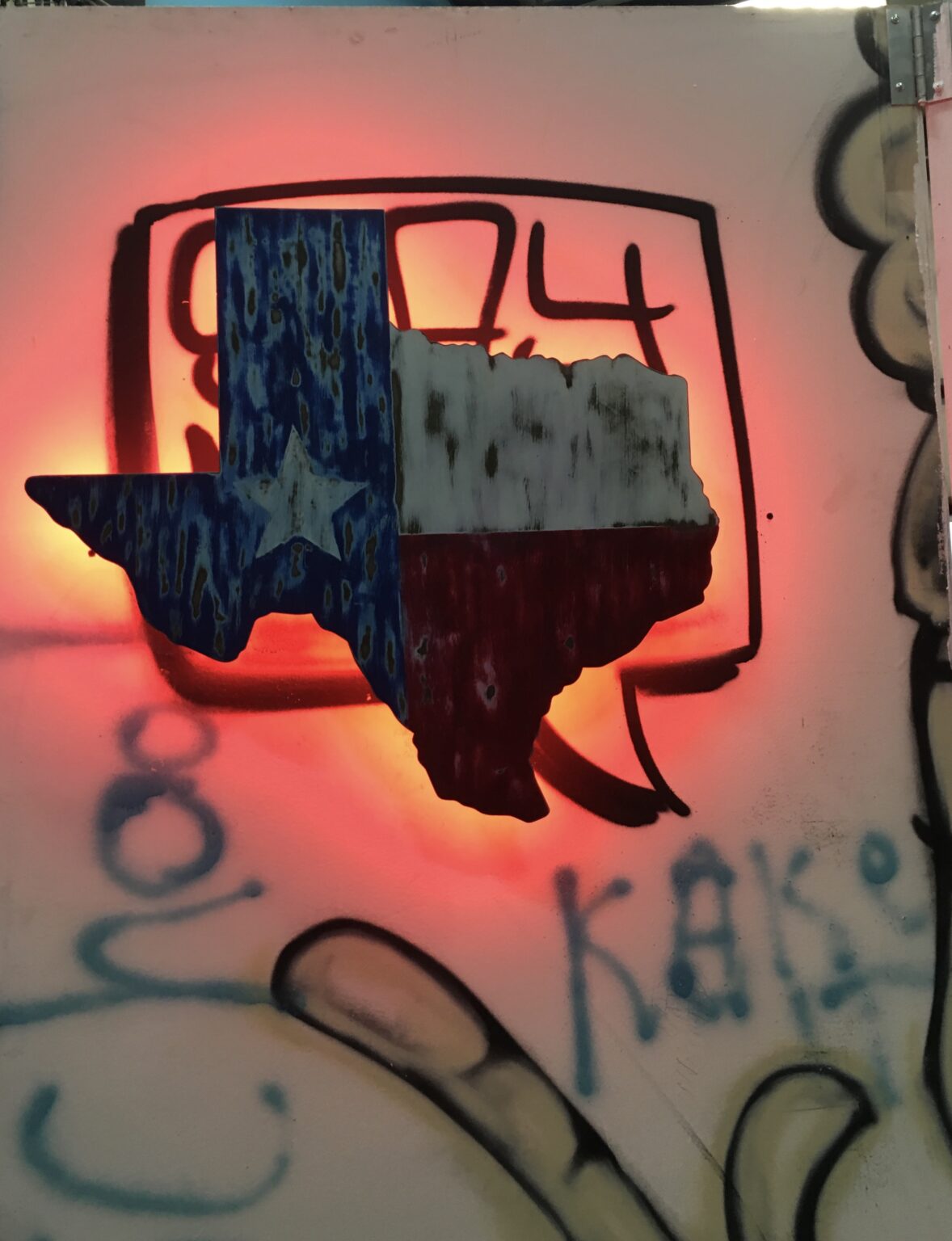 A texas state shaped light is lit up.